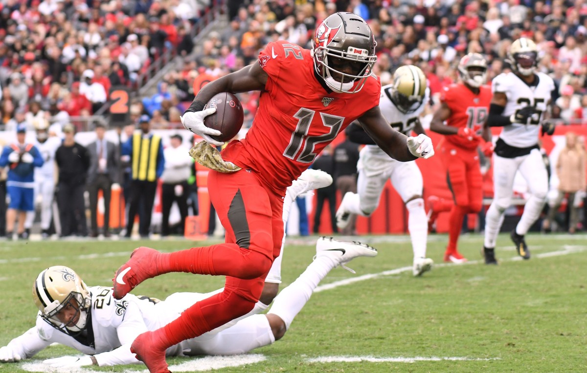 Tampa Bay Buccaneers receiver Chris Godwin (12) scores a touchdown against the New Orleans Saints. Mandatory Credit: Jonathan Dyer-USA TODAY 